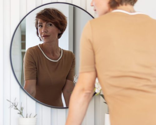 Elegant,Mature,Woman,With,Short,Hair,,Wearing,A,Casual,Beige